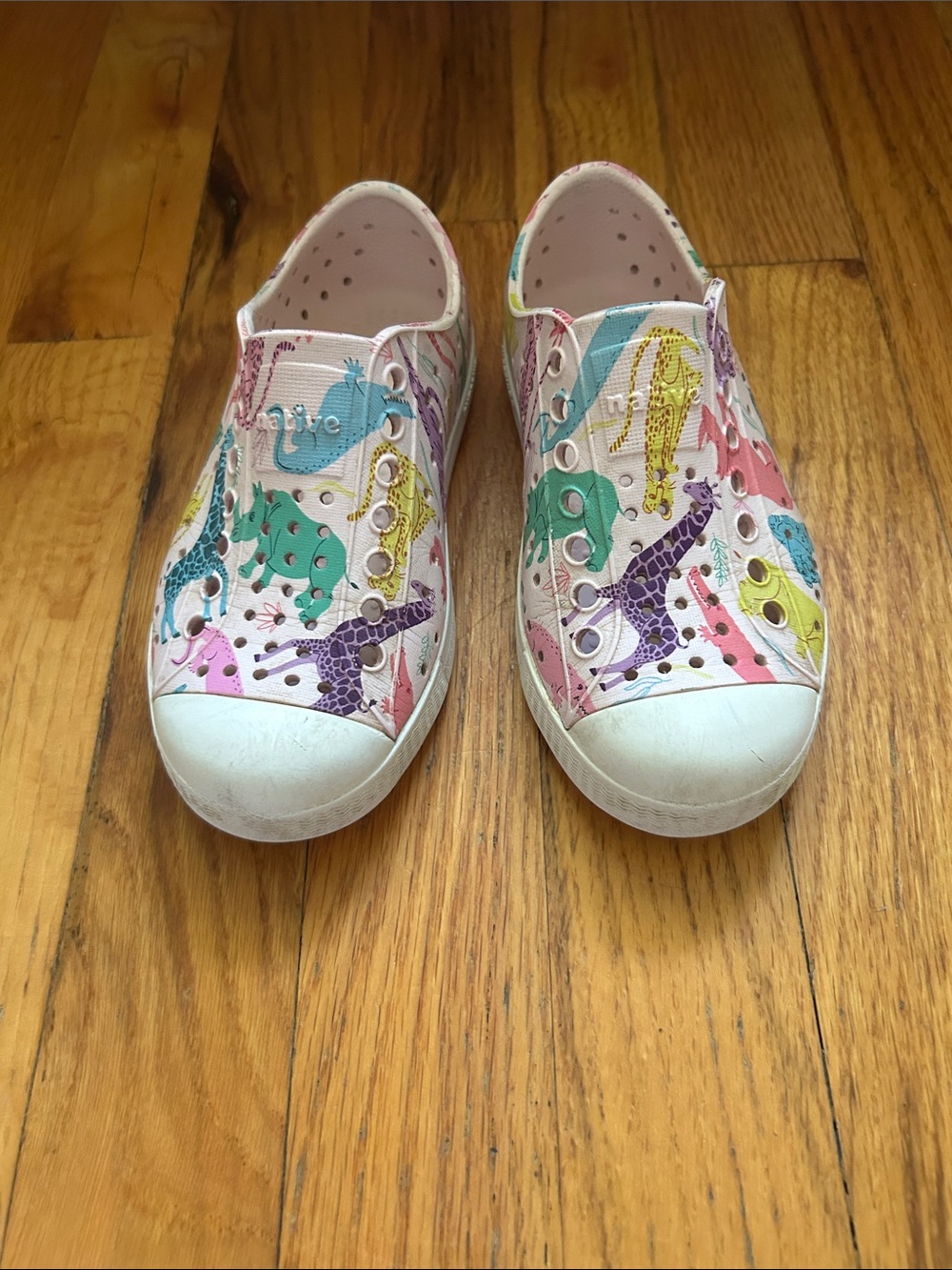 Native Kids White Slip-On Sneakers with Pink Multicolor Dino Print